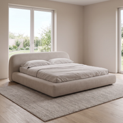 Luma Curve upholstered bed in light beige fabric, side view showing curved footboard